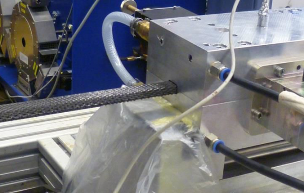 Producing a CFK-profile via microwave pultrusion tool